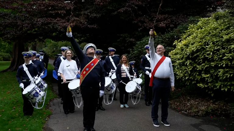 Liberal Democrat leader Ed Davey arrives at his party's conference in Bournemouth at the front of a marching band. 