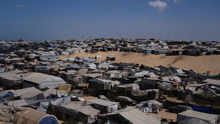 A tent camp for displaced Palestinians stretches along the Muwasi, in southern Gaza. Pic: AP/Jehad Alshrafi