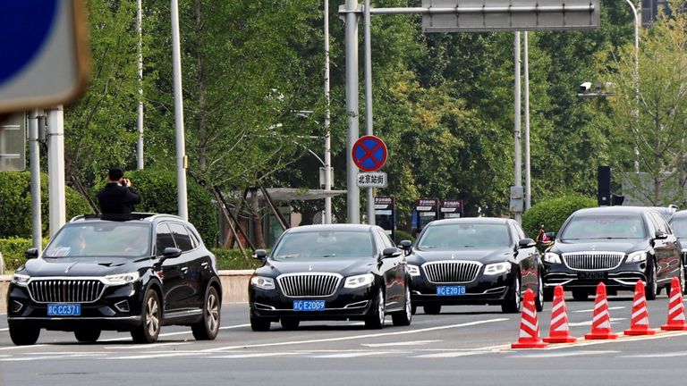 The motorcade believed to be carrying North Korean leader Kim Jong Un leaves Beijing railway station