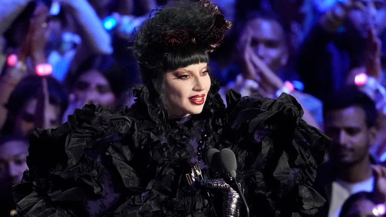 Lady Gaga accepts the award for artist of the year. Pic: AP