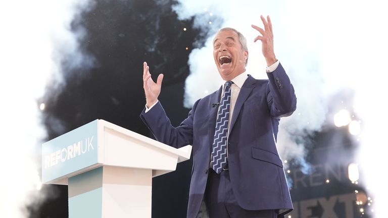 Nigel Farage on stage at the party's conference. Pic: PA