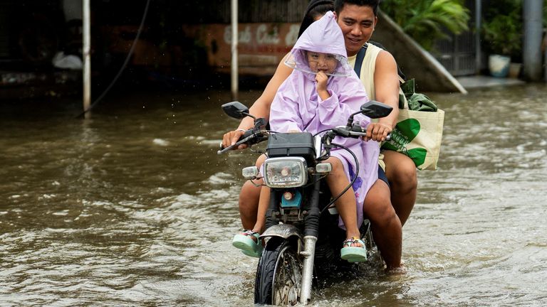 A flooded road in Apalit, Pampanga province, Philippines. Pic: Reuters