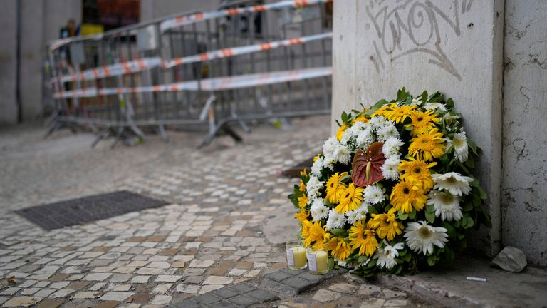 Flowers for the victims at the foot of the hill where the funicular is in downtown Lisbon on Friday. Pic: AP