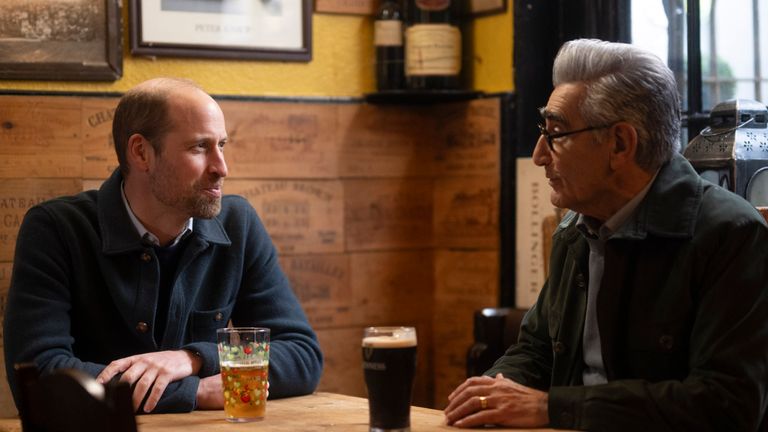 The Prince of Wales and Eugene Levy in a pub in Windsor. Pic: PA