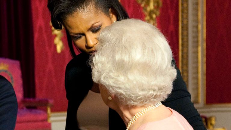 In a breach of protocol during a visit to the UK in 2009, Michelle Obama touched the late Queen. Pic: AP