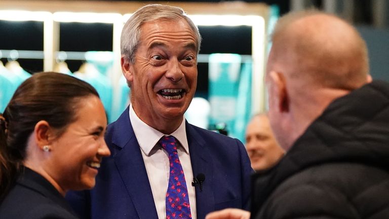 Reform UK leader Nigel Farage meets delegates at the party's annual conference. Pic: PA