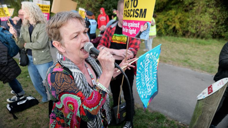 Sally Kincaid speaks during the counter-protest outside a hotel housing asylum seekers in Leeds