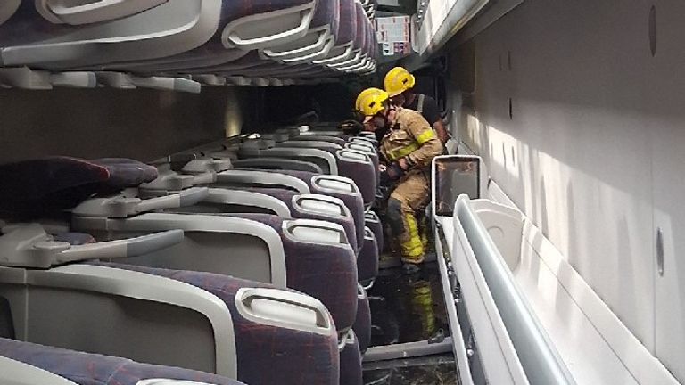Rescue teams inside the overturned coach. Pic: Catalonia fire department/@bomberscat/x