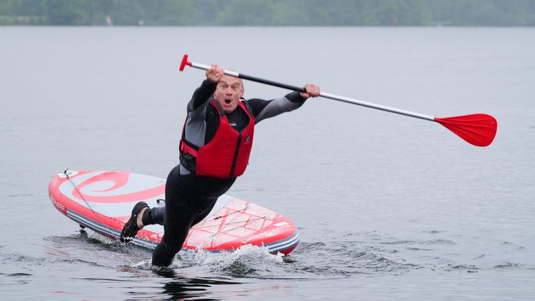 Sir Ed Davey falls into the water while paddleboarding during the General Election campaign trail in 2024. Pic: PA
