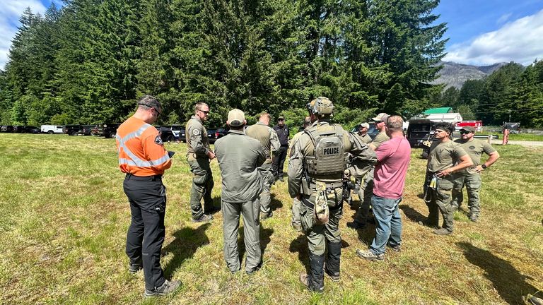 Snohomish County Sheriff's Office deputies participate in the search for Travis Decker.
Pic: Snohomish County Sheriff's Office/AP