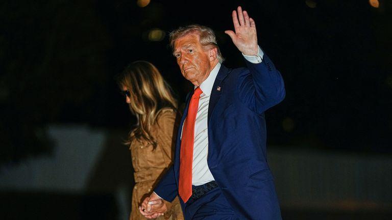 The Trumps arrive back at the White House in the early hours of Friday. Pic: Reuters