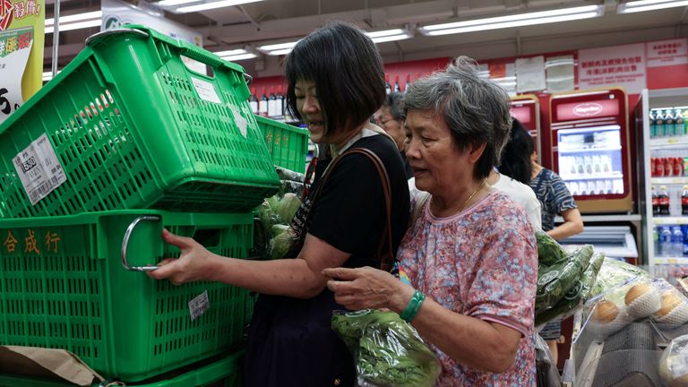 People in Hong Kong stockpiling supplies. Pic: Reuters