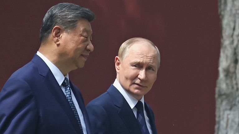 Putin and Xi take a walk at the Zhongnanhai leadership compound in Beijing