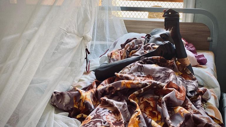 Maaz, 18, a victim of a gunshot wound, is treated in the last functioning hospital in North Darfur