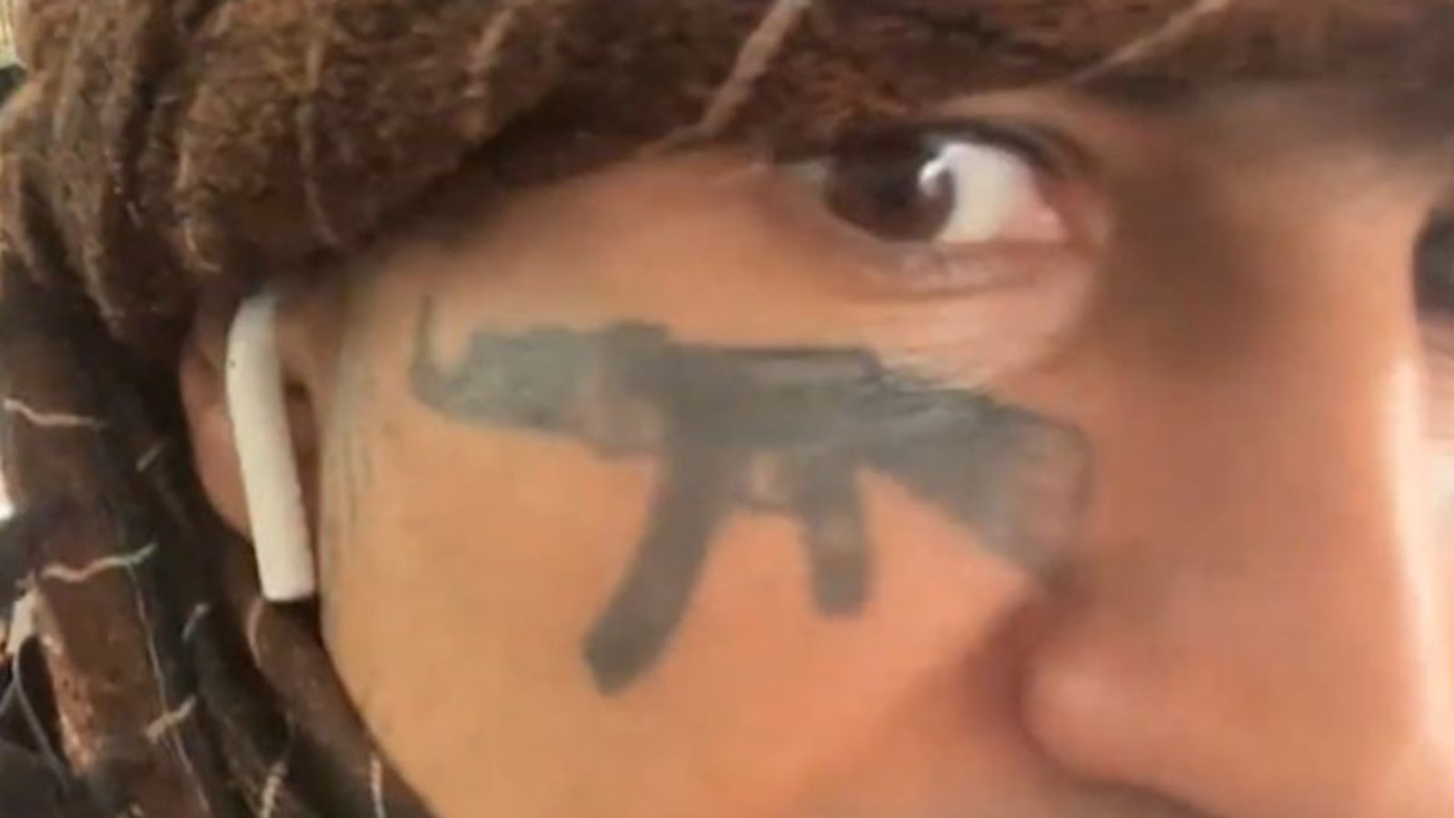 Migrant with AK-47 face tattoo who threatened to kill Nigel Farage shouts from dock as he's jailed