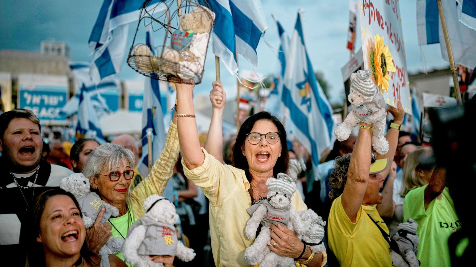 Chants of frustration turn into songs of celebration in Tel Aviv as crowds greet hostages