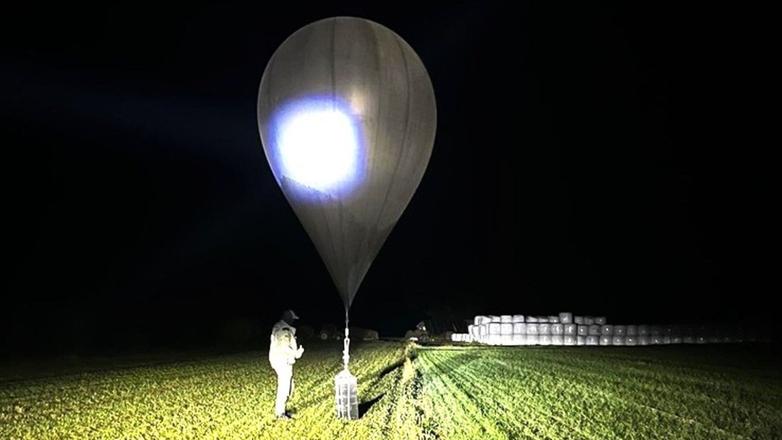 Airport halts flights after balloons used by cigarette smugglers breach airspace