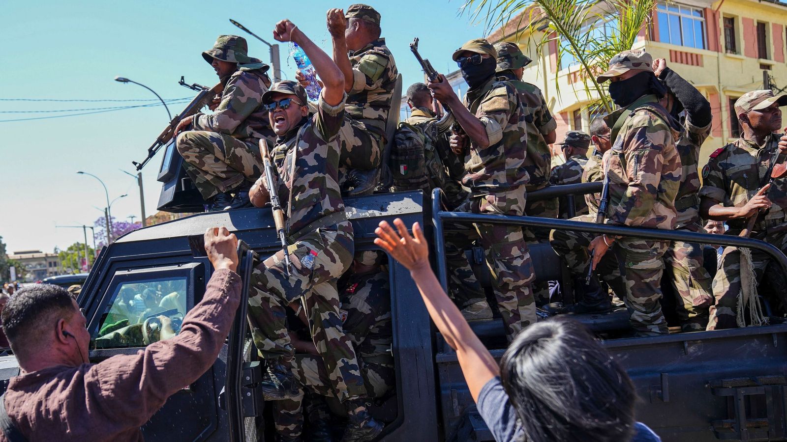 Madagascar president says coup under way as soldiers join protesters