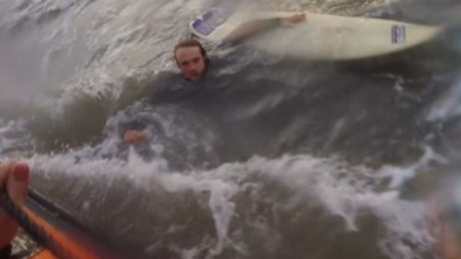 Video shows surfer being rescued by RNLI after powerful rip current dragged him out to sea