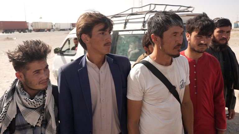 Rohullah Mohammadi, in the blue suit, says he was sent back to Afghanistan