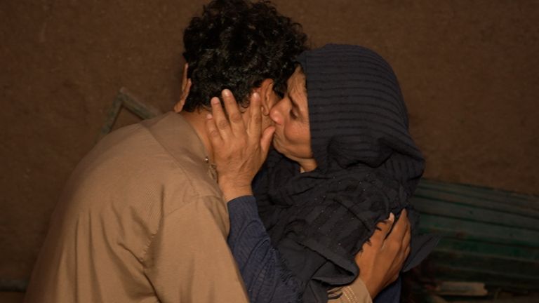 Tahir's mother embraces him on his return