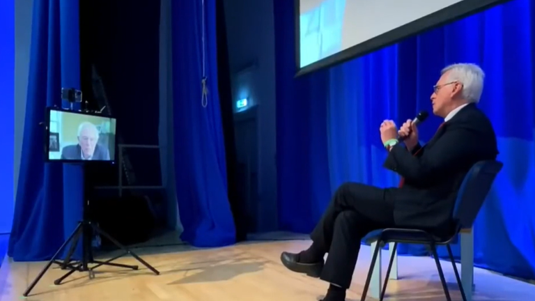 Bernie Sanders and John McDonnell in conversation at TWT in 2021