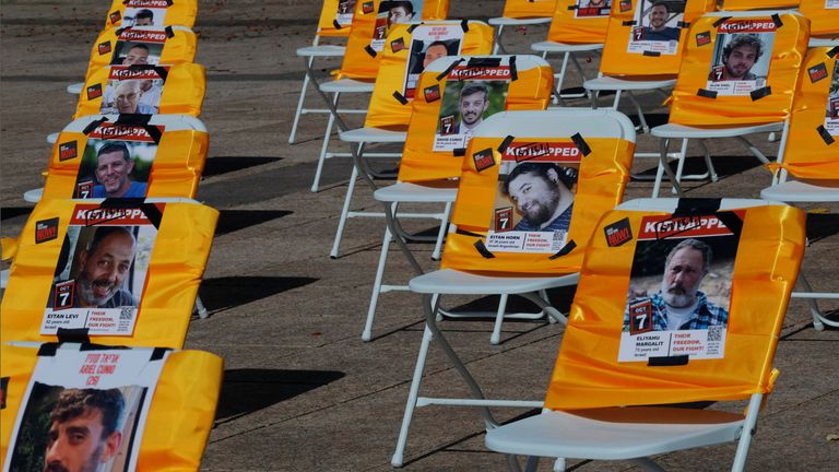 Images of hostages are displayed at a memorial event at Boston University. Pic: Reuters