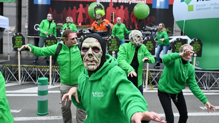 Demonstrators dressed as zombies in Brussels. Pic: AP