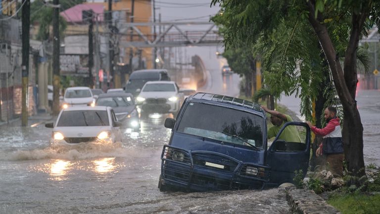 Cars were abandoned after floods caused by Hurricane Melissa in the Dominican Republic. Pic: AP