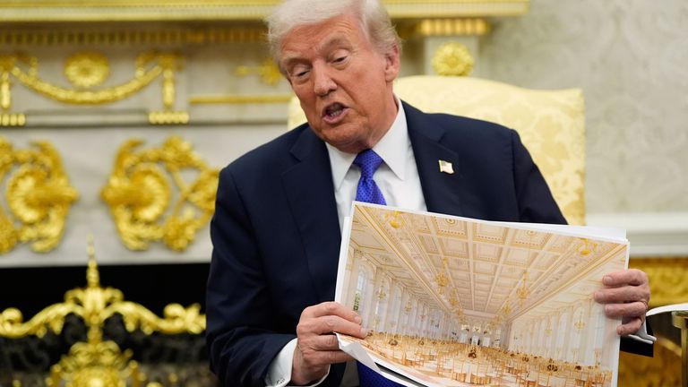 Trump shows off an artist's impressions of his new ballroom. Pic:AP