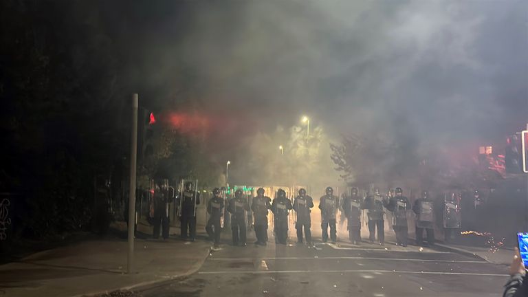 A number of protesters have been detained after fireworks and rocks were thrown at police. Pic: PA