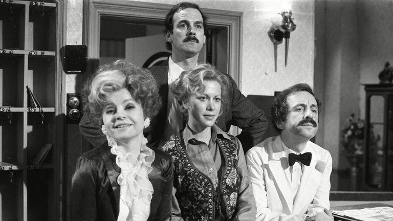 Prunella Scales (left), pictured here in 1979 as Sybil, alongside John Cleese (back centre) who played Basil Fawlty. Pic: Eugene Adebari/Shutterstock