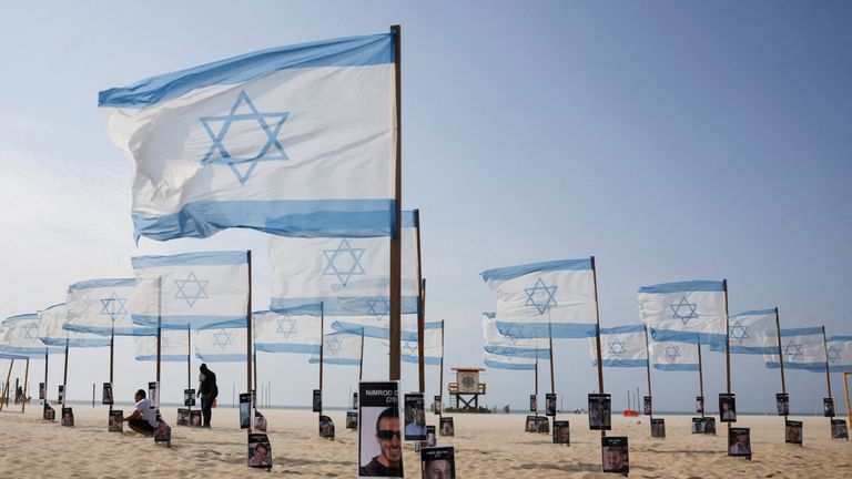 Activists in Brazil set up an installation on Copacabana Beach in Rio de Janeiro showing hostages. Pic: Reuters