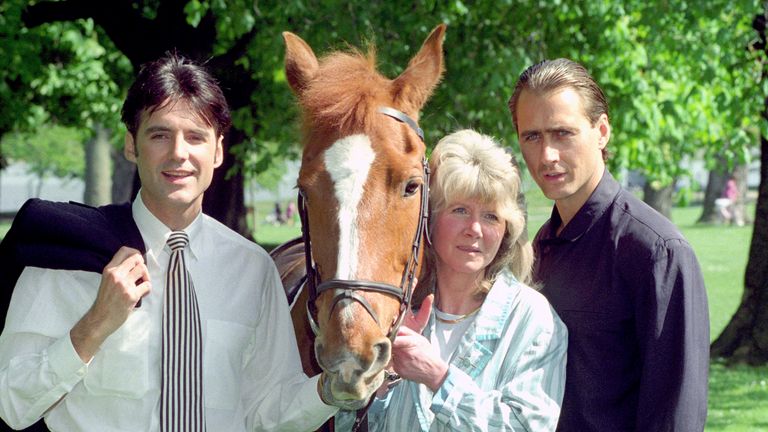 Author Jilly Cooper with two stars of a mini TV series based on her book Riders. Pic: PA
