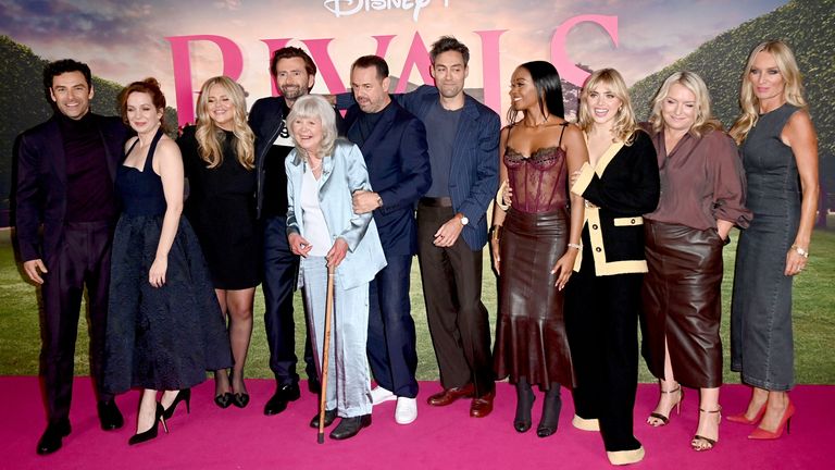 Jilly Cooper with cast members from Rivals in 2024. Pic: Hogan Media/Shutterstock 