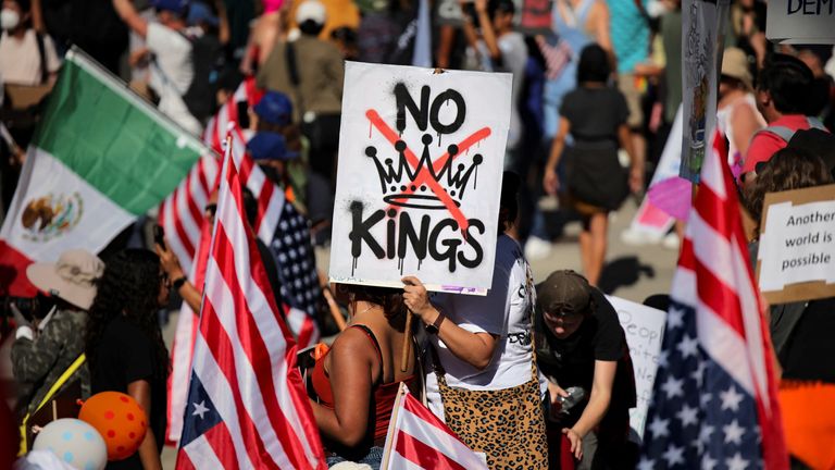 A 'No Kings' sign, outside City Hall in Los Angeles, represents a protest against what is seen as increasingly authoritarian rule. Pic: Reuters