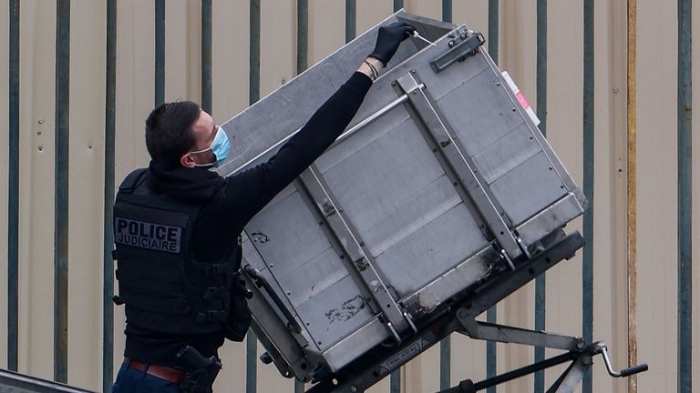 An officer swabs the cherry picker. Pic: Louvre