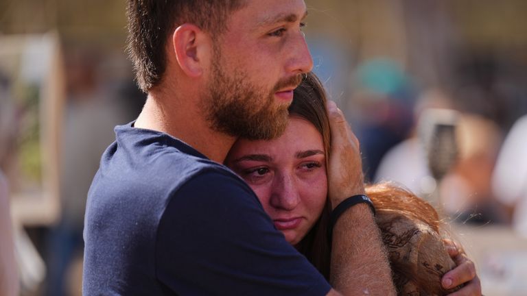 Mourners gathered at a memorial at the site of the Nova music festival. Pic: AP