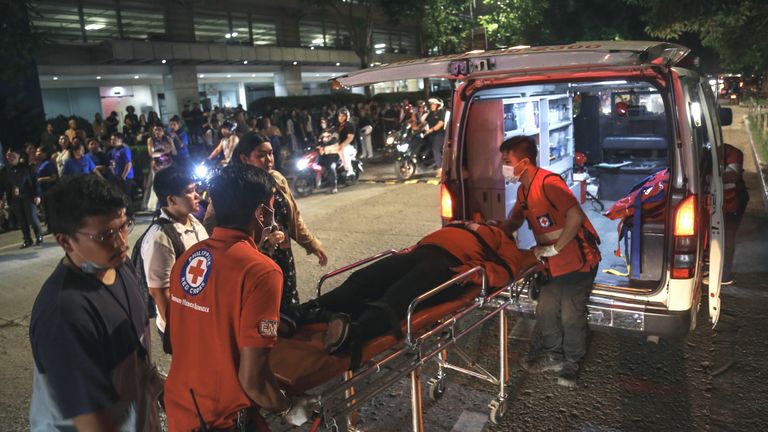 Medical teams in Cebu city, central Philippines, help the injured.  Pic: AP