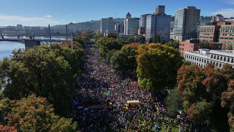 Thousands gather along a waterfront in Portland, Oregon. Pic: AP