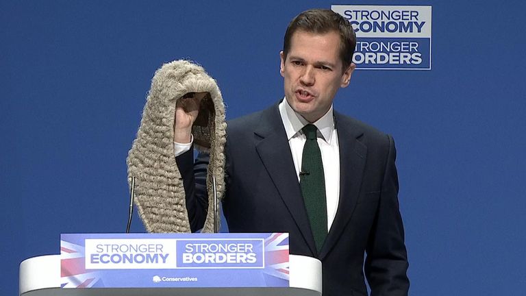 Mr Jenrick held up a judge's wig at the Tory conference