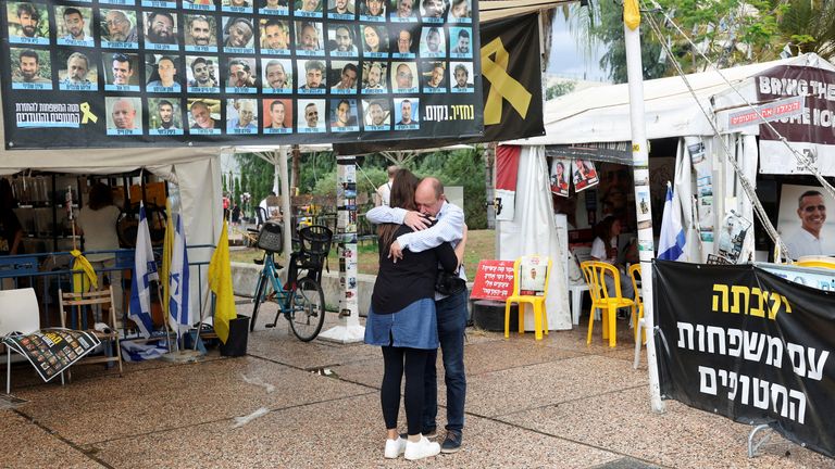 People hug next in Hostages Square. Pic: Reuters