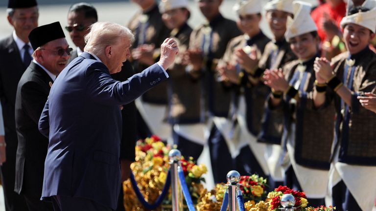 Mr Trump joins performers in a dance during a welcome ceremony at Kuala Lumpur International Airport. Pic: Reuters