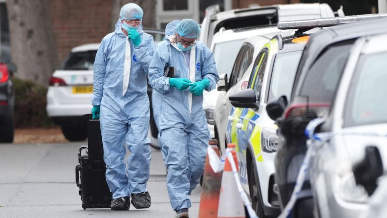 Forensic officers in Midhurst Gardens in Uxbridge.
Pic: PA