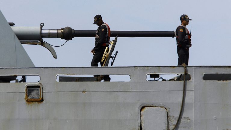 Sailors work on a Venezuelan Navy patrol boat off the Caribbean coast. Pic: Reuters