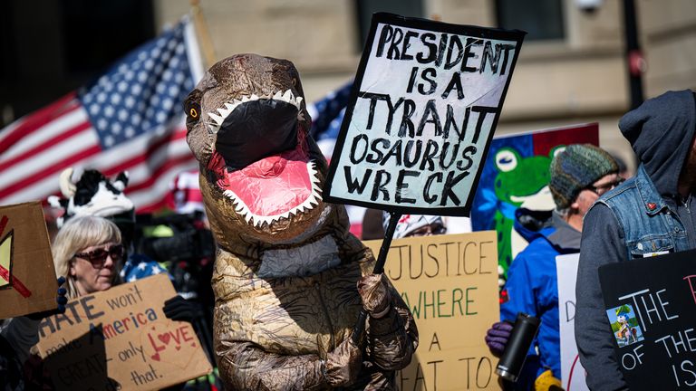 Protesters at the Wyoming State Capitol are been creative with their signs. Pic: Wyoming Tribune Eagle/AP