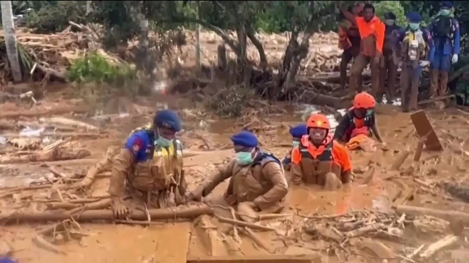 Rescuers struggle to find survivors after devastating floods and ...