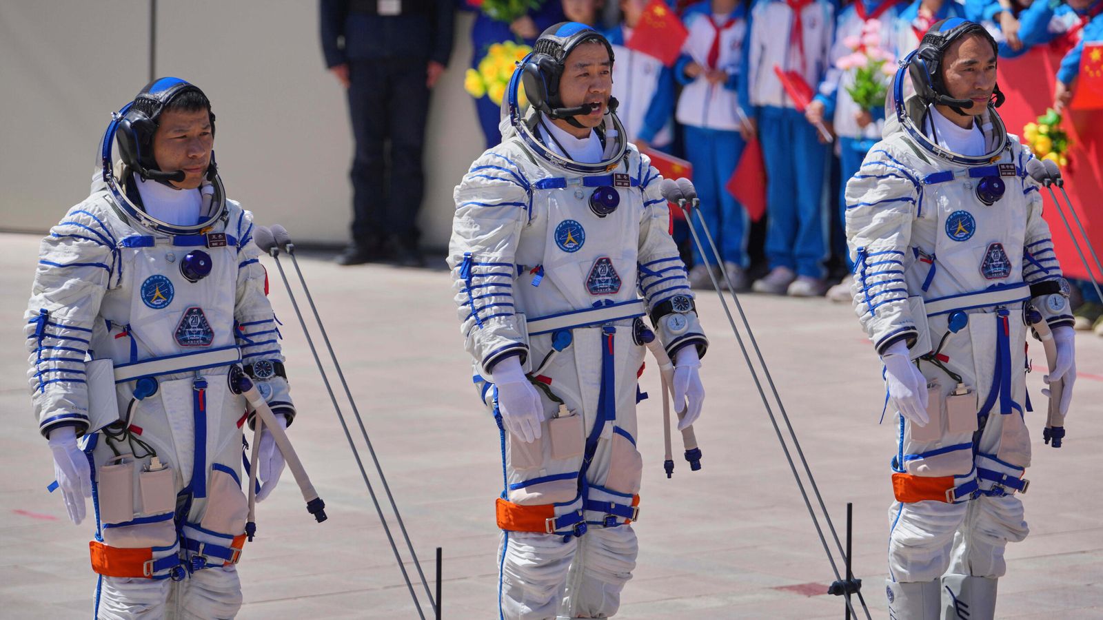 Stranded Chinese astronauts return to Earth after space capsule damaged