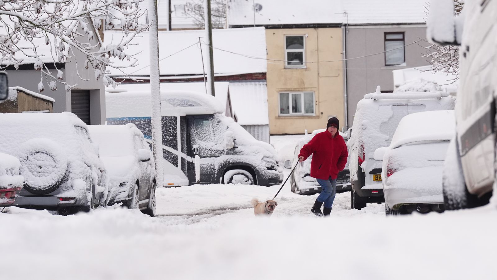 Weather warnings in place as parts of UK hit by heavy snow