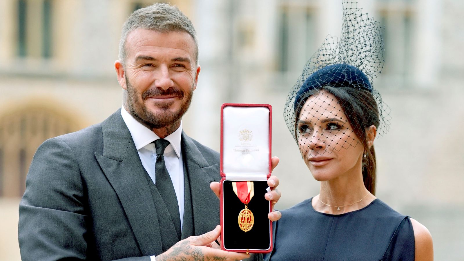 Arise, Sir David! Beckham receives knighthood from the King